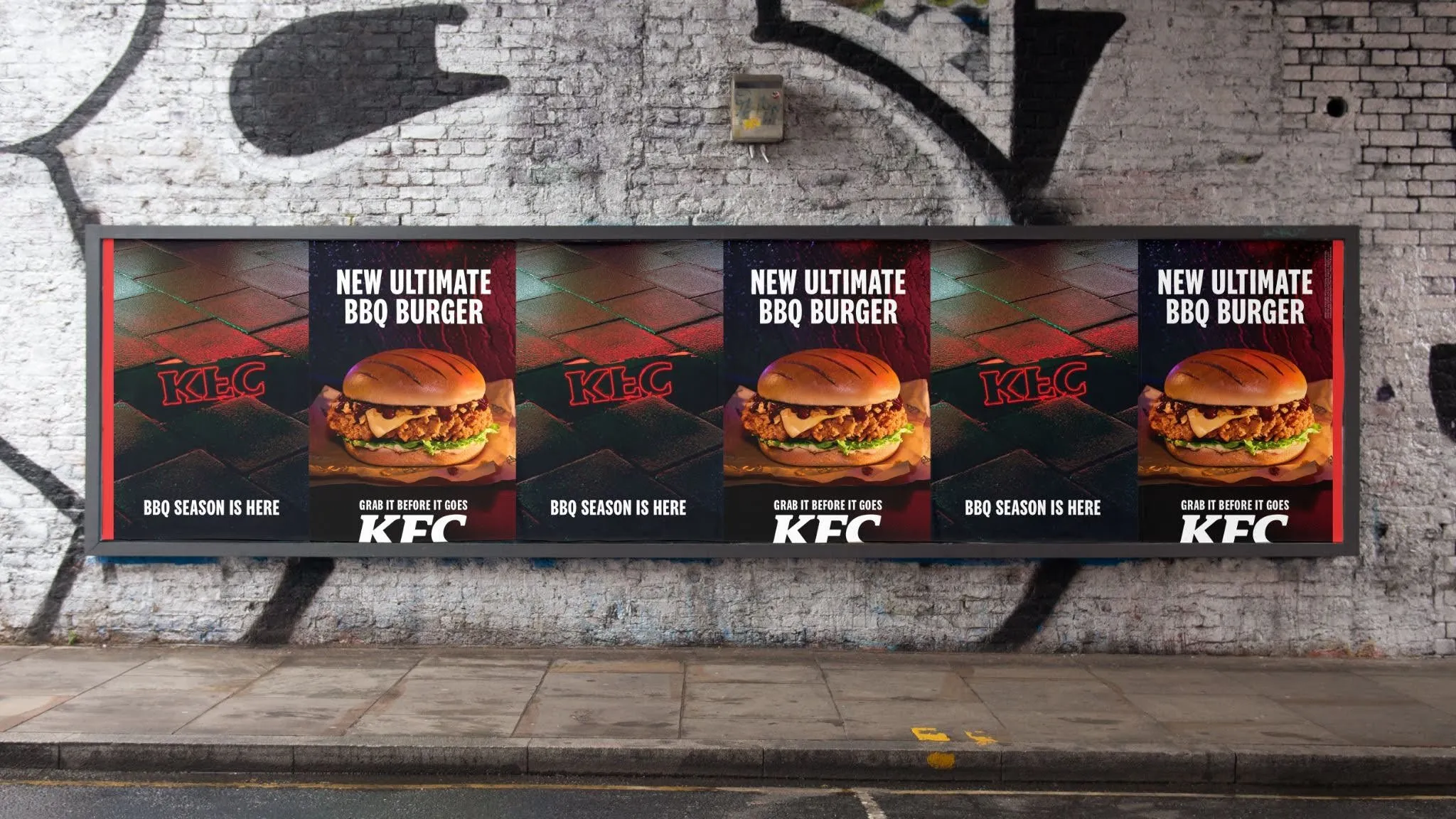Long billboard repeating the BBQ season and burger executions, against a graffitied wall